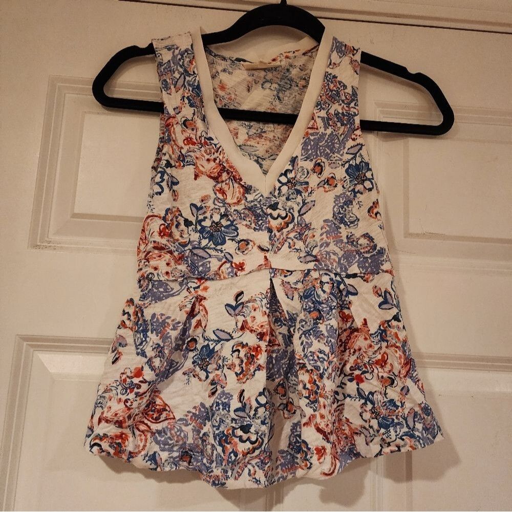 Deletta white, blue, and red floral sleeveless peplum blouse